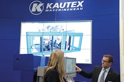 A Kautex official demostrates the company's developed Virtual Trainer simulator program. A Kautex official demostrates the company's developed Virtual Trainer simulator program.