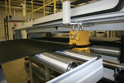 As The Beast extrudes TPO with a haircell finish, an “isotope measurement system,†the yellow box, gauges the sheet. As The Beast extrudes TPO with a haircell finish, an “isotope measurement system,†the yellow box, gauges the sheet.