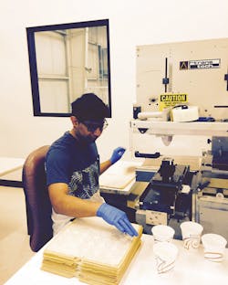 Machine operator Cesar Galindo conducts pad printing at Ess Tec. Machine operator Cesar Galindo conducts pad printing at Ess Tec.