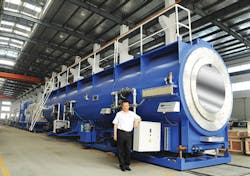 This 2,000mm vacuum cooling tank for extruded pipe shows the colossal scale of the equipment used to make big pipe. This 2,000mm vacuum cooling tank for extruded pipe shows the colossal scale of the equipment used to make big pipe.