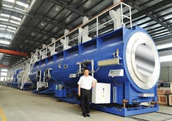 This 2,000mm vacuum cooling tank for extruded pipe shows the colossal scale of the equipment used to make big pipe. This 2,000mm vacuum cooling tank for extruded pipe shows the colossal scale of the equipment used to make big pipe.