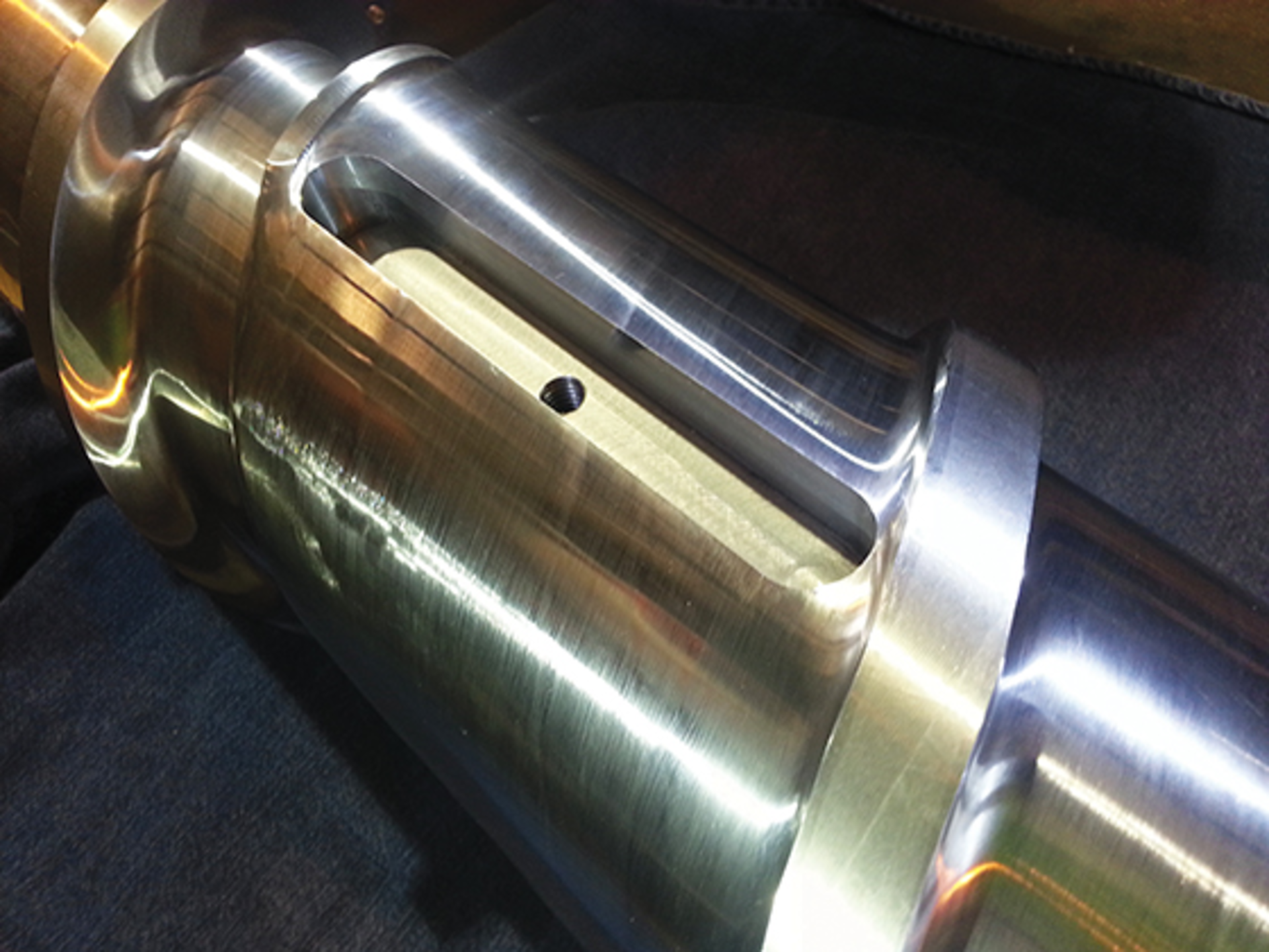 A range of scrap materials can be processed on a single screw if it is outfitted with a specially designed stainless steel barrier or dam. Designed by R. Dray Manufacturing, the dam can be raised or lowered to improve processing.