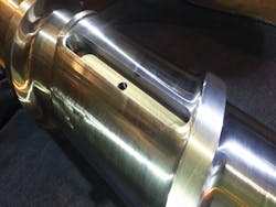 A range of scrap materials can be processed on a single screw if it is outfitted with a specially designed stainless steel barrier or dam. Designed by R. Dray Manufacturing, the dam can be raised or lowered to improve processing. A range of scrap materials can be processed on a single screw if it is outfitted with a specially designed stainless steel barrier or dam. Designed by R. Dray Manufacturing, the dam can be raised or lowered to improve processing.