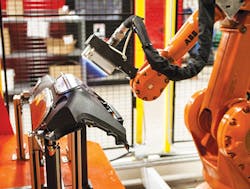 An Enercon flame treater applies surface treatment to an auto dashboard. An Enercon flame treater applies surface treatment to an auto dashboard.