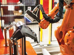 An Enercon flame treater applies surface treatment to an auto dashboard. An Enercon flame treater applies surface treatment to an auto dashboard.