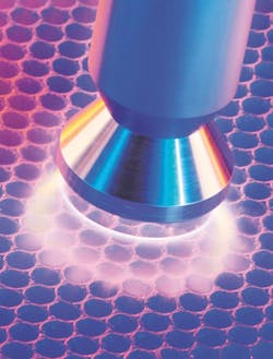 Pretreating the fine ribs of a PP honeycomb core with plasma ensures long-term, strong bonding with the panel&apos;s surface layers.