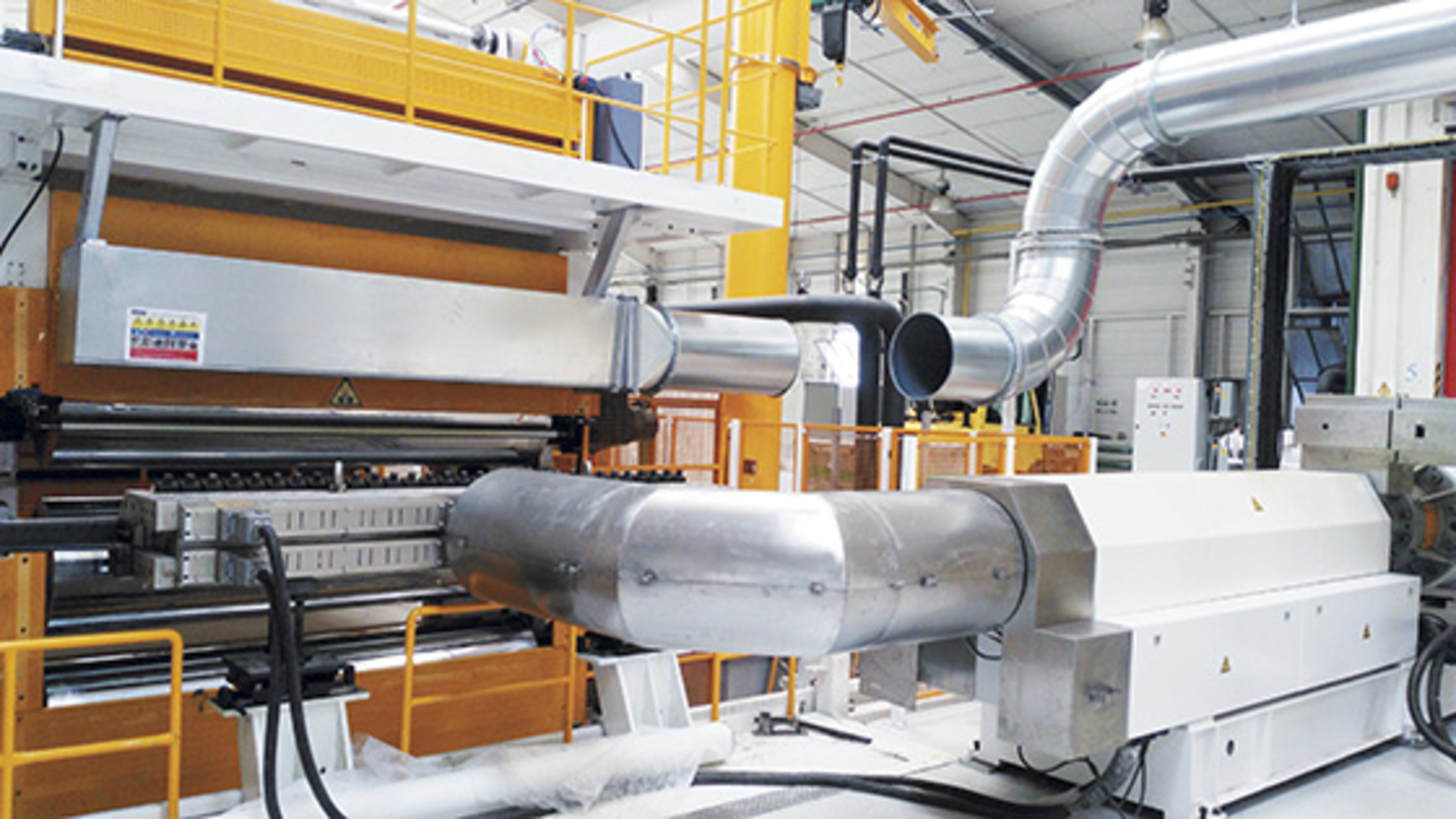 After being processed by a single-screw extruder, material enters an accumulator to increase its performance going into the die.