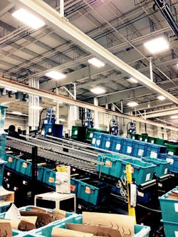 Conveying lines run down from a row of vertical presses at WMM's Grand Haven, Mich., facility. Conveying lines run down from a row of vertical presses at WMM's Grand Haven, Mich., facility.