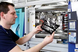 KraussMaffei's patented Adaptive Process Control provides valuable support for the mold setter. Germany's KH Foliotec GmbH uses a KraussMaffei machine to mold a two-component radio dial panel. KraussMaffei's patented Adaptive Process Control provides valuable support for the mold setter. Germany's KH Foliotec GmbH uses a KraussMaffei machine to mold a two-component radio dial panel.