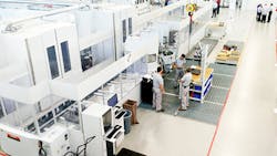 A view of the production floor of the new facility during an open house. A view of the production floor of the new facility during an open house.