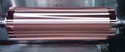 A diamond turned/engraved lenticular pattern in the copper plating which is wrapped around the top of the steel base roll. A diamond turned/engraved lenticular pattern in the copper plating which is wrapped around the top of the steel base roll.