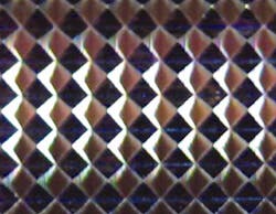 A four-sided pyramidal structure (1.25mm height) made by JacoTech. A four-sided pyramidal structure (1.25mm height) made by JacoTech.