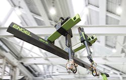Two Engel viper 40 robots mounted on the same beam utilize the company&apos;s latest vibration-control technology. The technology allows for synchronization of the independent robot movements.