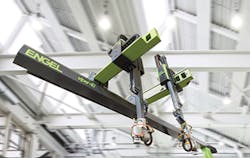 Two Engel viper 40 robots mounted on the same beam utilize the company’s latest vibration-control technology. The technology allows for synchronization of the independent robot movements. Two Engel viper 40 robots mounted on the same beam utilize the company’s latest vibration-control technology. The technology allows for synchronization of the independent robot movements.
