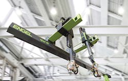 Two Engel viper 40 robots mounted on the same beam utilize the company's latest vibration-control technology. The technology allows for synchronization of the independent robot movements. Two Engel viper 40 robots mounted on the same beam utilize the company's latest vibration-control technology. The technology allows for synchronization of the independent robot movements.