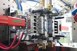 Engel and Hack integrated injection molding steps into a single production cell for clean-room molding. Engel and Hack integrated injection molding steps into a single production cell for clean-room molding.