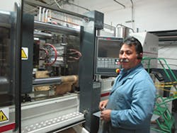 GM Jesus Hernandez sets up the adapter plate at a press where a new robot will be installed. GM Jesus Hernandez sets up the adapter plate at a press where a new robot will be installed.Â