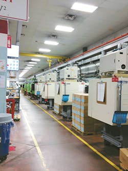 An injection molding cell at Currier Plastics An injection molding cell at Currier Plastics