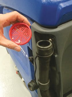 A filter produced on a 3-D MakerBot printer captures resin from a floor sweeper. A filter produced on a 3-D MakerBot printer captures resin from a floor sweeper.