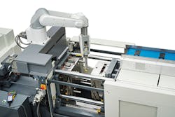 Toshiba Machine's TV1000 six-axis robot is integrated into an all-electric Toshiba Machine EC110 SX II injection press. Toshiba Machine's TV1000 six-axis robot is integrated into an all-electric Toshiba Machine EC110 SX II injection press.
