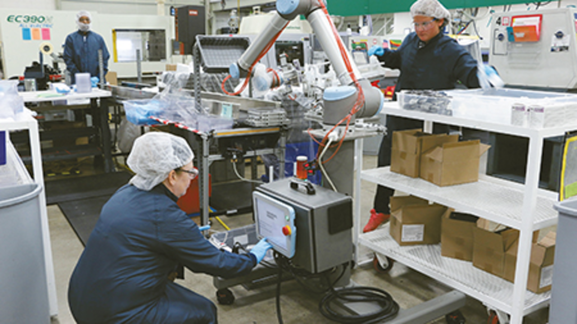 A robot at Dynamic Group is controlled by a programming device offered by Universal Robots.