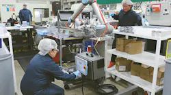 A robot at Dynamic Group is controlled by a programming device offered by Universal Robots.