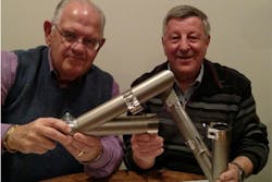Chuck Thiele, left, and former Motan CEO Walter Kramer inspect the Link Connector manifold that is at the heart of the newly developed FlexFree Link Matrix manifolds. Chuck Thiele, left, and former Motan CEO Walter Kramer inspect the Link Connector manifold that is at the heart of the newly developed FlexFree Link Matrix manifolds.