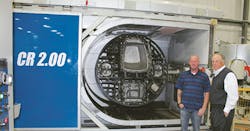 Simplay3 founder Tom Murdough, right, and plant manager Gabe Parsons stand beside a Rotoline rotomolding machine. Simplay3 founder Tom Murdough, right, and plant manager Gabe Parsons stand beside a Rotoline rotomolding machine.