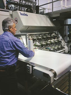 Illig's Klaus Wolf stacks PP containers that were in-mold labeled on Illig's RDM 70Kc thermoformer. Illig's Klaus Wolf stacks PP containers that were in-mold labeled on Illig's RDM 70Kc thermoformer.