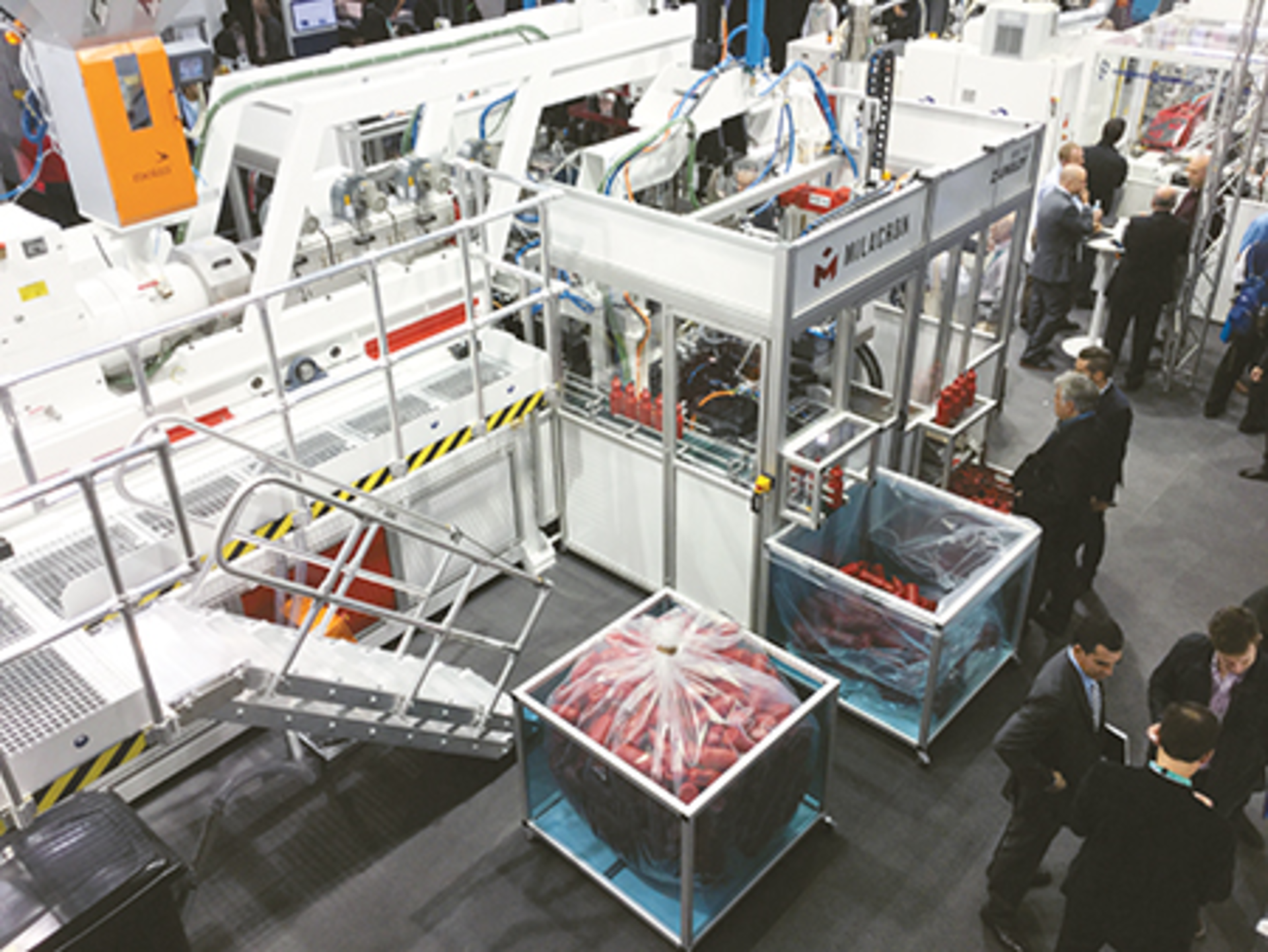 the Uniloy All-Electric Shuttle Blow Molding Machine M20.75 ED is shown running at the K show.