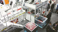 the Uniloy All-Electric Shuttle Blow Molding Machine M20.75 ED is shown running at the K show.