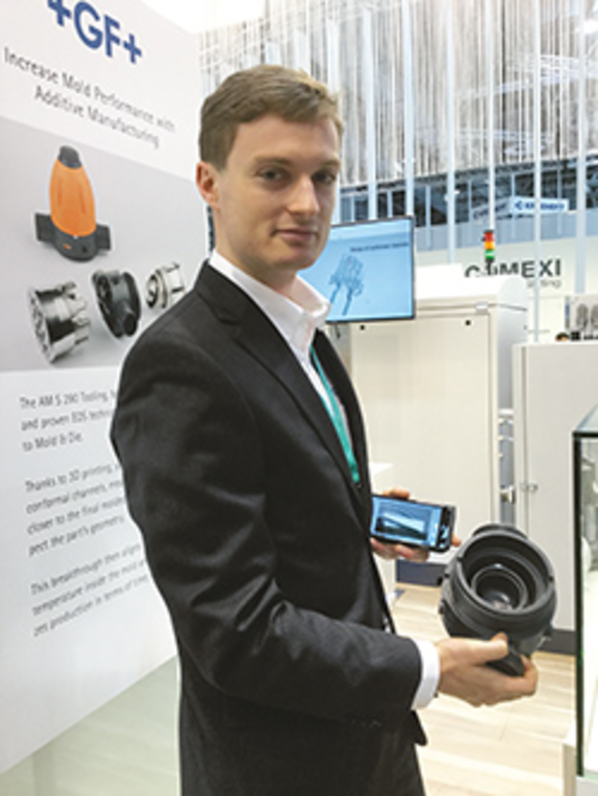 Bernd Wiedmann of EOS holds a valve mold component at the K show./EOS of North America Inc.
