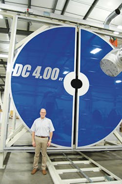 Bob Sly with one of his company's large rotational molding systems/PMM Bob Sly with one of his company's large rotational molding systems/PMM