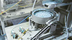 An automated screw-driving unit is used to assemble an appliance door that requires 34 screws./PMM