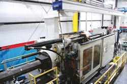 One of six cells configured with an Ube injection molding machine and a Sepro robot./PMM One of six cells configured with an Ube injection molding machine and a Sepro robot./PMM