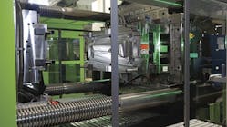 In the DecoJect process, a decorative film is shaped by the contour of the injection mold in a thermoforming vacuum step, then the film is back-injection molded in a highly automated roll-to-roll process. In the DecoJect process, a decorative film is shaped by the contour of the injection mold in a thermoforming vacuum step, then the film is back-injection molded in a highly automated roll-to-roll process.