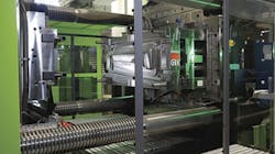 In the DecoJect process, a decorative film is shaped by the contour of the injection mold in a thermoforming vacuum step, then the film is back-injection molded in a highly automated roll-to-roll process. In the DecoJect process, a decorative film is shaped by the contour of the injection mold in a thermoforming vacuum step, then the film is back-injection molded in a highly automated roll-to-roll process.