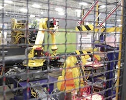 A cell uses multiple six-axis Fanuc robots. A cell uses multiple six-axis Fanuc robots.