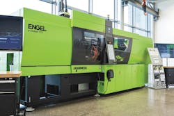 Engel's e-motion machine has been modified to handle the higher temperatures required for metal forming. Engel's e-motion machine has been modified to handle the higher temperatures required for metal forming.