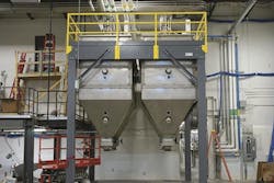Nordson uses surge bins that can each hold 10,000 pounds of resin. Nordson uses surge bins that can each hold 10,000 pounds of resin.