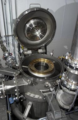 To reduce particle size, Custom Processing Services sends the material through a fluidized-bed jet mill, right, where compressed air is blasted at supersonic velocities to force particles to collide. To reduce particle size, Custom Processing Services sends the material through a fluidized-bed jet mill, right, where compressed air is blasted at supersonic velocities to force particles to collide.