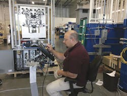 A technician works on a robot integration project at Sepro America. A technician works on a robot integration project at Sepro America.