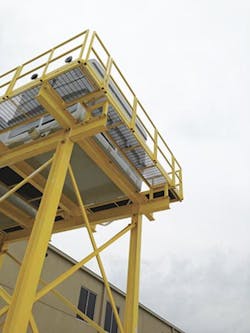 Conair's cooling tower system sits atop a platform outside of a facility. Conair's cooling tower system sits atop a platform outside of a facility.