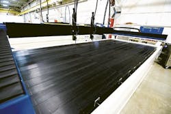 The E-2040 system from WardJet includes shuttle tables that allow an operator to load and unload material while another cut is being performed. The E-2040 can cut at speeds of over 750 inches per minute. The E-2040 system from WardJet includes shuttle tables that allow an operator to load and unload material while another cut is being performed. The E-2040 can cut at speeds of over 750 inches per minute.