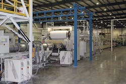 A KraussMaffei Berstorff KMD 164 twin-screw extruder produces PVC foam sheet. A KraussMaffei Berstorff KMD 164 twin-screw extruder produces PVC foam sheet.