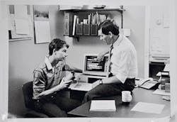 Don Paulson reviews the latest computer-based courseware with developer and son Scott Paulson, circa 1980. Don Paulson reviews the latest computer-based courseware with developer and son Scott Paulson, circa 1980.
