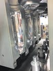 A W. Amsler all-electric reheat stretch blow molder produces PET bottles at NPE2018./W. Amsler Equipment Inc.