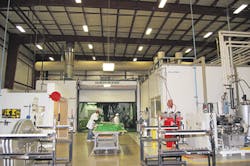 The KraussMaffei-manufactured double-shuttle mold carrier system/PMM The KraussMaffei-manufactured double-shuttle mold carrier system/PMM