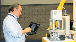 Micro Interface Design engineering manager Antonio Nucaro adjusts the Midexx Traceability color-management system during NPE2018./Micro Interface Design