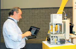 Micro Interface Design engineering manager Antonio Nucaro adjusts the Midexx Traceability color-management system during NPE2018./Micro Interface Design